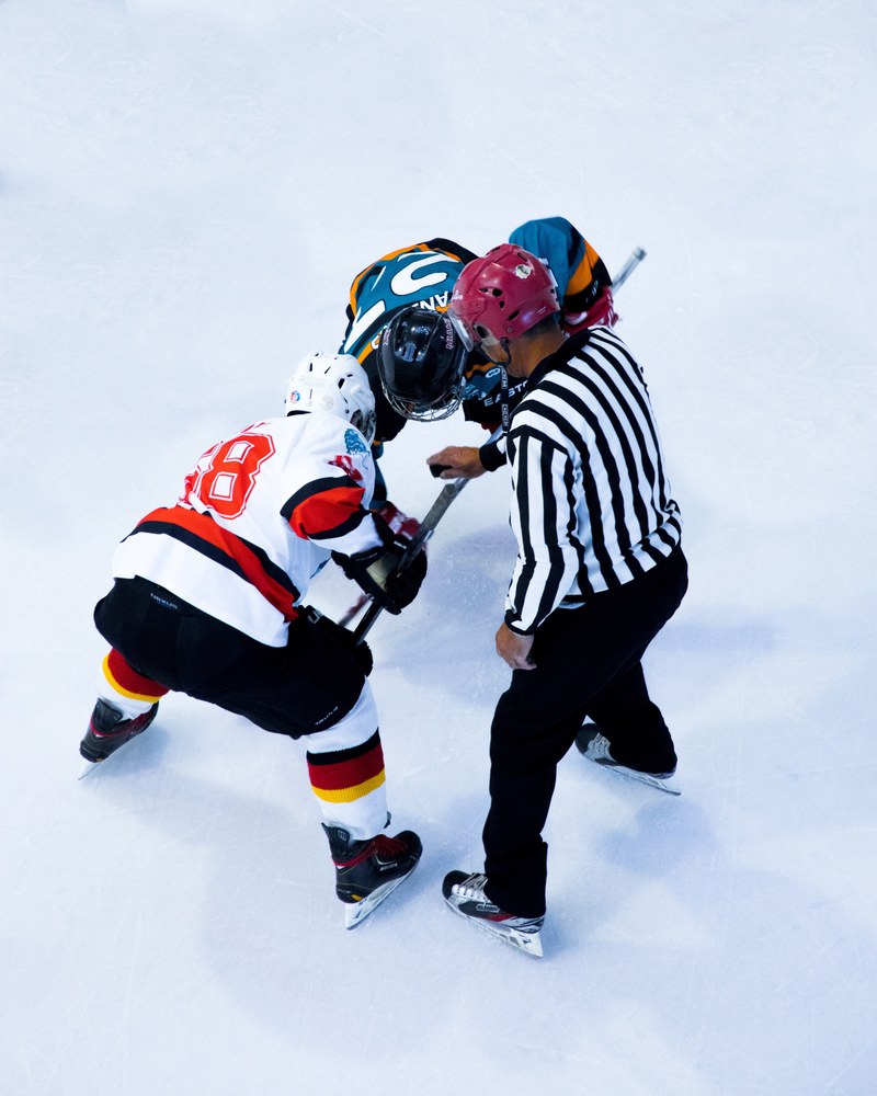 two hockey players waiting for the ref to drop the puck during a faceoff, ice hockey 4k