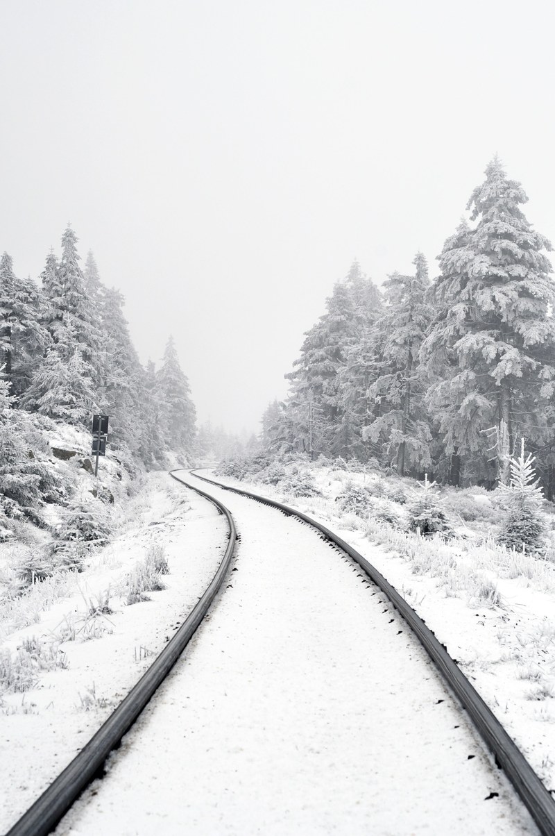train tracks covered in snow on a cold winter day, harz germany 4k