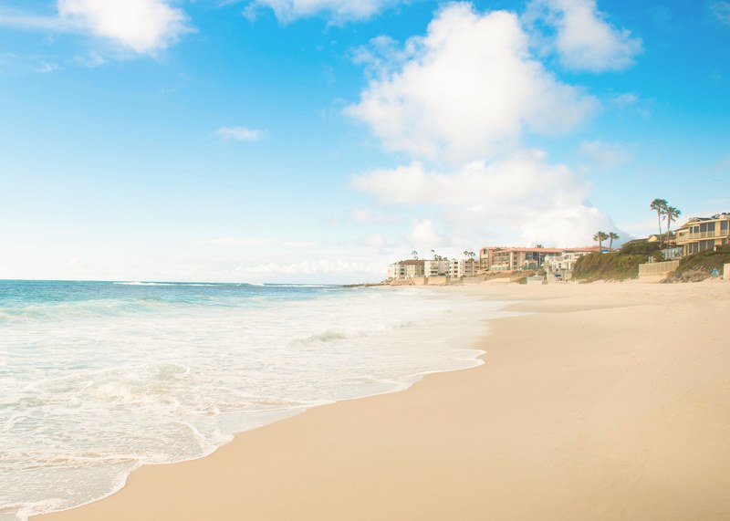 view of the coastal houses from the sand beach by the ocean, view of the coastal houses 4k