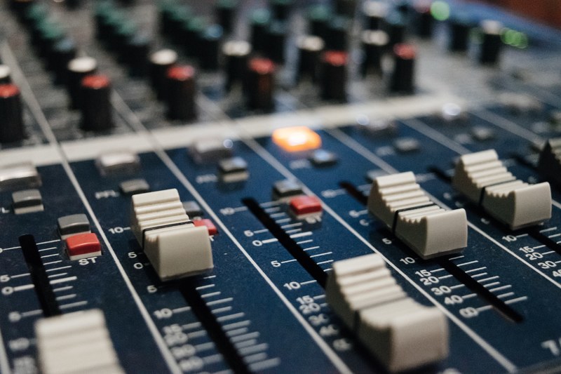 a close up of white dials on a music mixer, white music mixing dials 4k