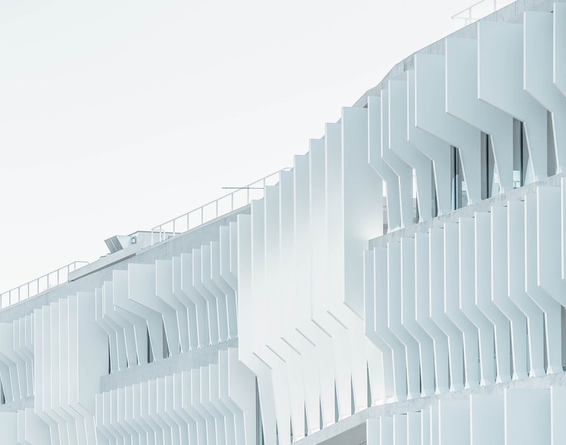 a white facade viewed from a drone in madrid, madrid building facade 4k