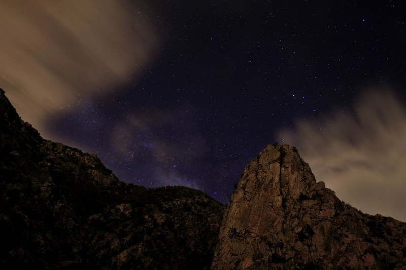 a starlit sky over jagged mountain peaks in al bahah, mountain stars 4k