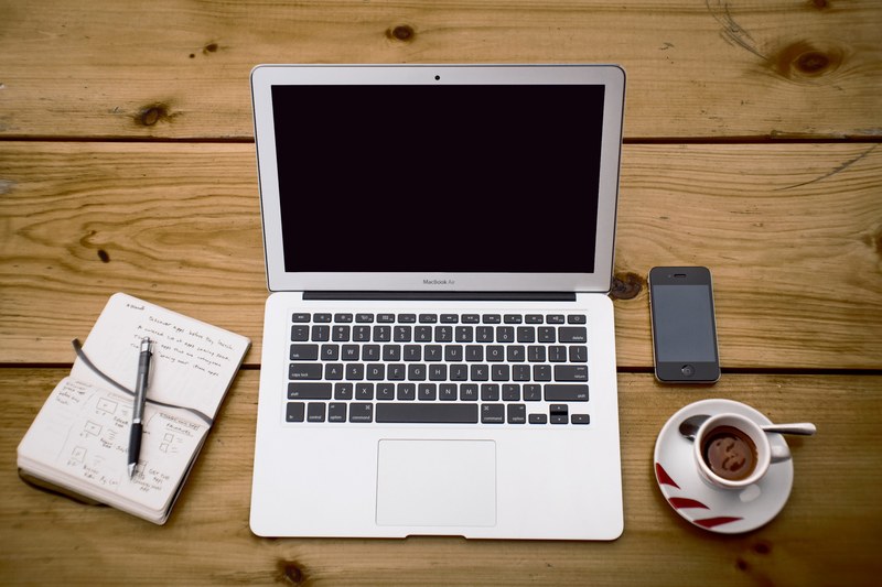 the display of technology devices including apple macbook iphone smartphone displayed on a table, _iphone macbook and smartphone on a table 4k