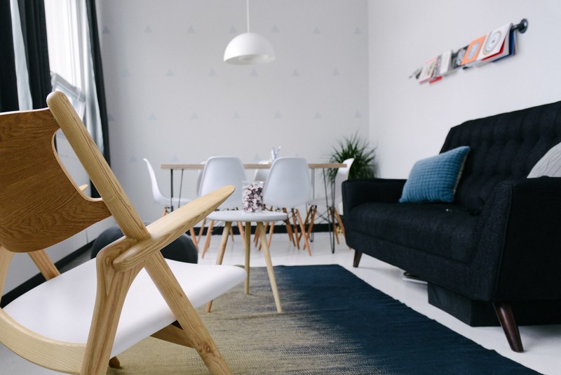 white chairs and a black sofa in a rest area in an office, office rest area 4k