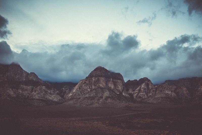 gray clouds gathering over rock formations in red rock canyon, red rock 4k
