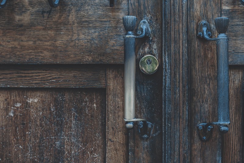a big wooden door with brass handles, wooden door 4k