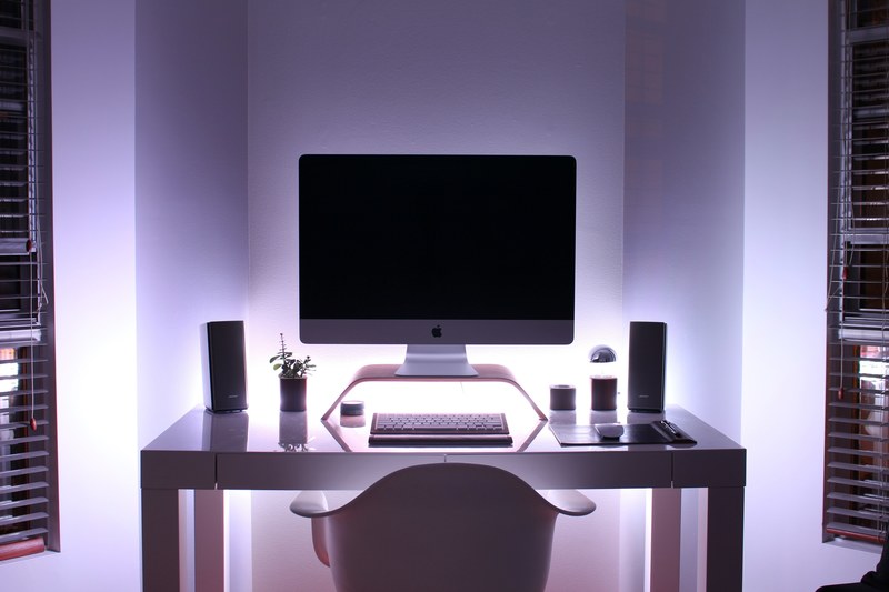 a powered off monitor on a computer desk, _gabriel beaudrys desk setup at night 4k
