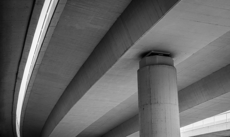black and white shot of concrete bridge architecture from below most na adi, below bridge most na adi 4k