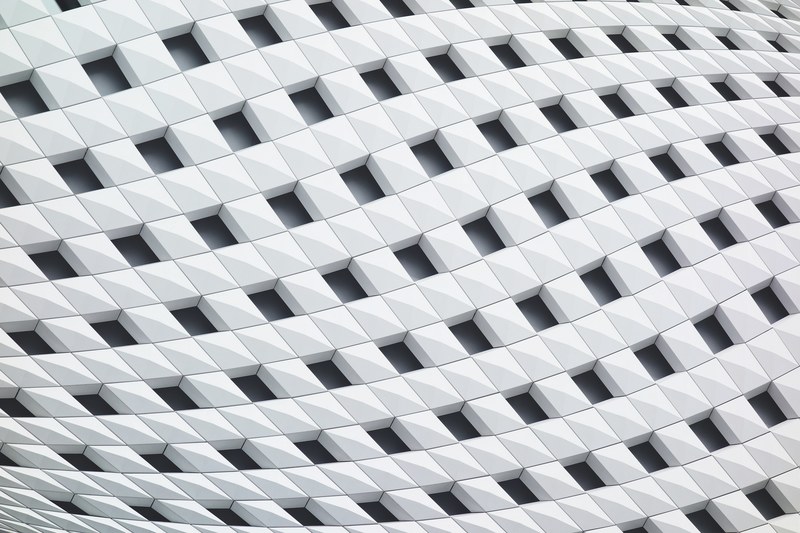 a curving facade with a latticework of white tiles, ginza place 4k