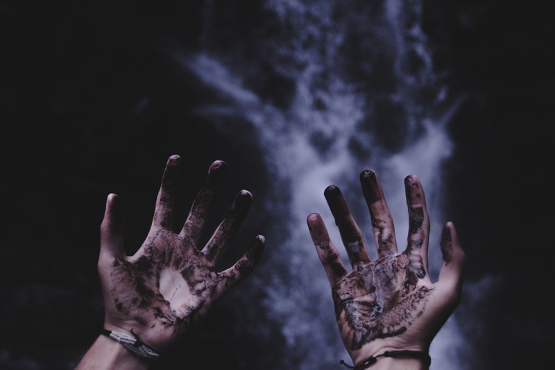 a view of a man with both dirty hands and wearing a bracelet on both of them, _darkness unleashed 4k