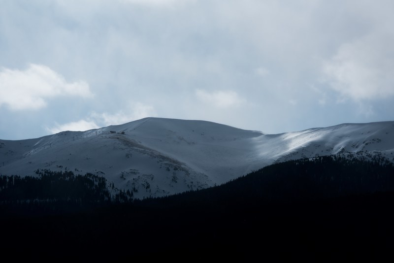 a mountain covered in snow stands tall near the clouds, a mountain covered in snow near clouds 4k