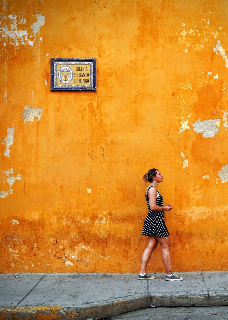 woman orange sign and sidewalk hd, 4k