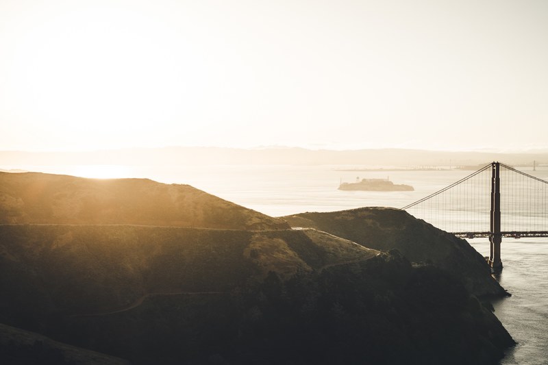 sunrise at the coast with mountains and a bridge in marin headlands, foggy morning on the coast 4k