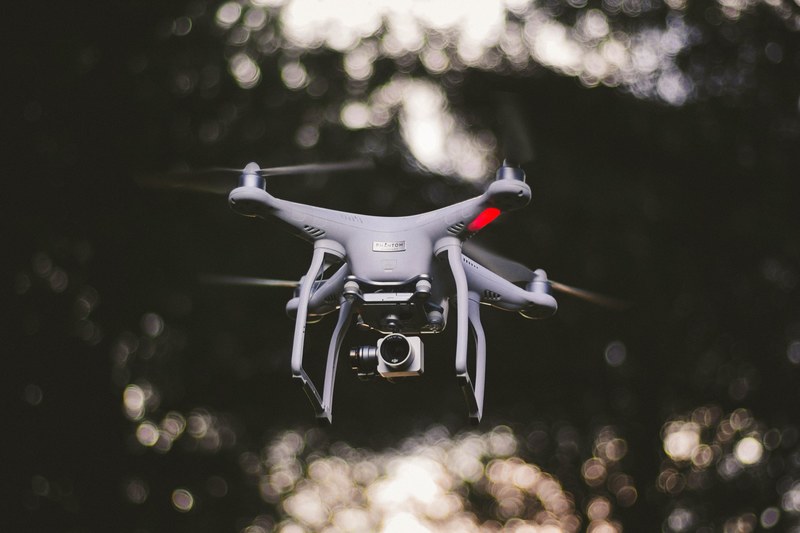 dji phantom drone hovering in air, dji phantom drone mid flight 4k