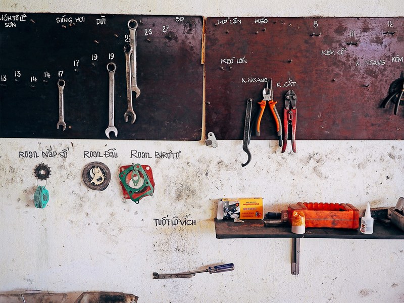 a workshop wall with handwriting to label the different tools, road to m sn 4k