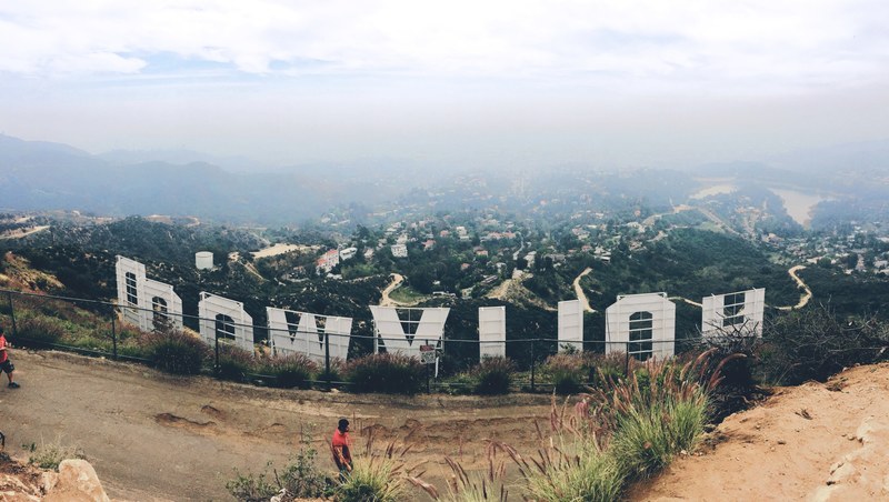 behind the hollywood sign in los angeles on a cloudy day, behind a la landmark 4k