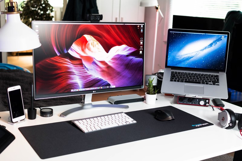 a computer workspace with a display a macbook and various accessories, grovemade submission my workspace 4k