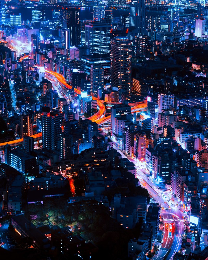 beautiful skyline of tokyo with orange and blue lights illuminating its streets, tokyo infinity 4k