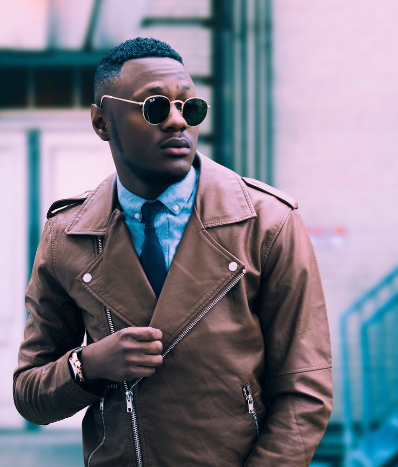 an elegant man in sunglasses and a leather jacket, confidence is key 4k