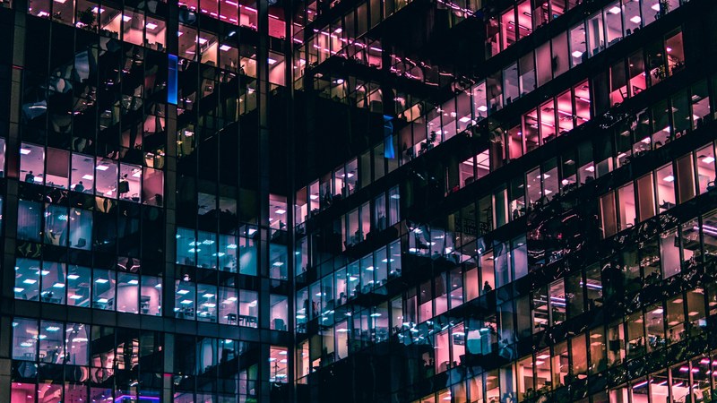lights in the windows of an office building in moscow, illuminated offices in moscow 4k