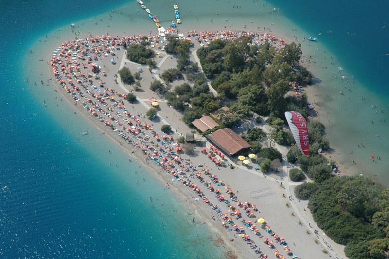 drone view of a crowded sand beach in ldeniz, fethiye blue lagoon 4k
