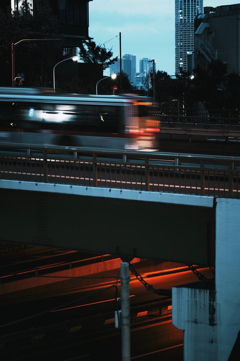a shot of both the overpass and underpass in a city with little traffic, _japan 2017 4k