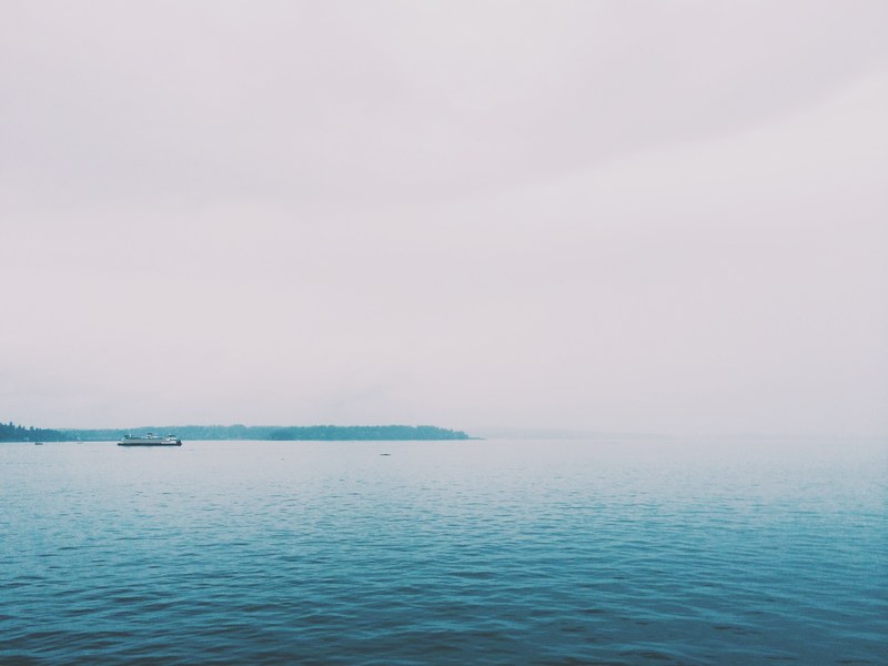 boat passes through calm ripples on a foggy day on the water, calm ripples 4k