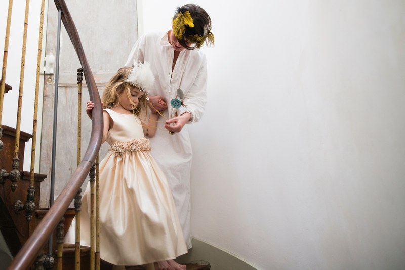 mother and daughter dressed elegantly in white descending a turn in a staircase, _coming downstairs 4k