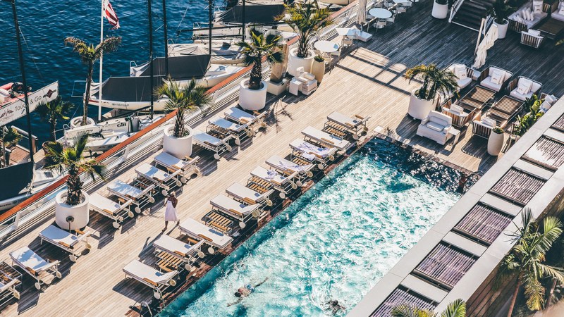 top view of rows of deck chairs and a small pool on a luxury boat, luxury boat deck 4k