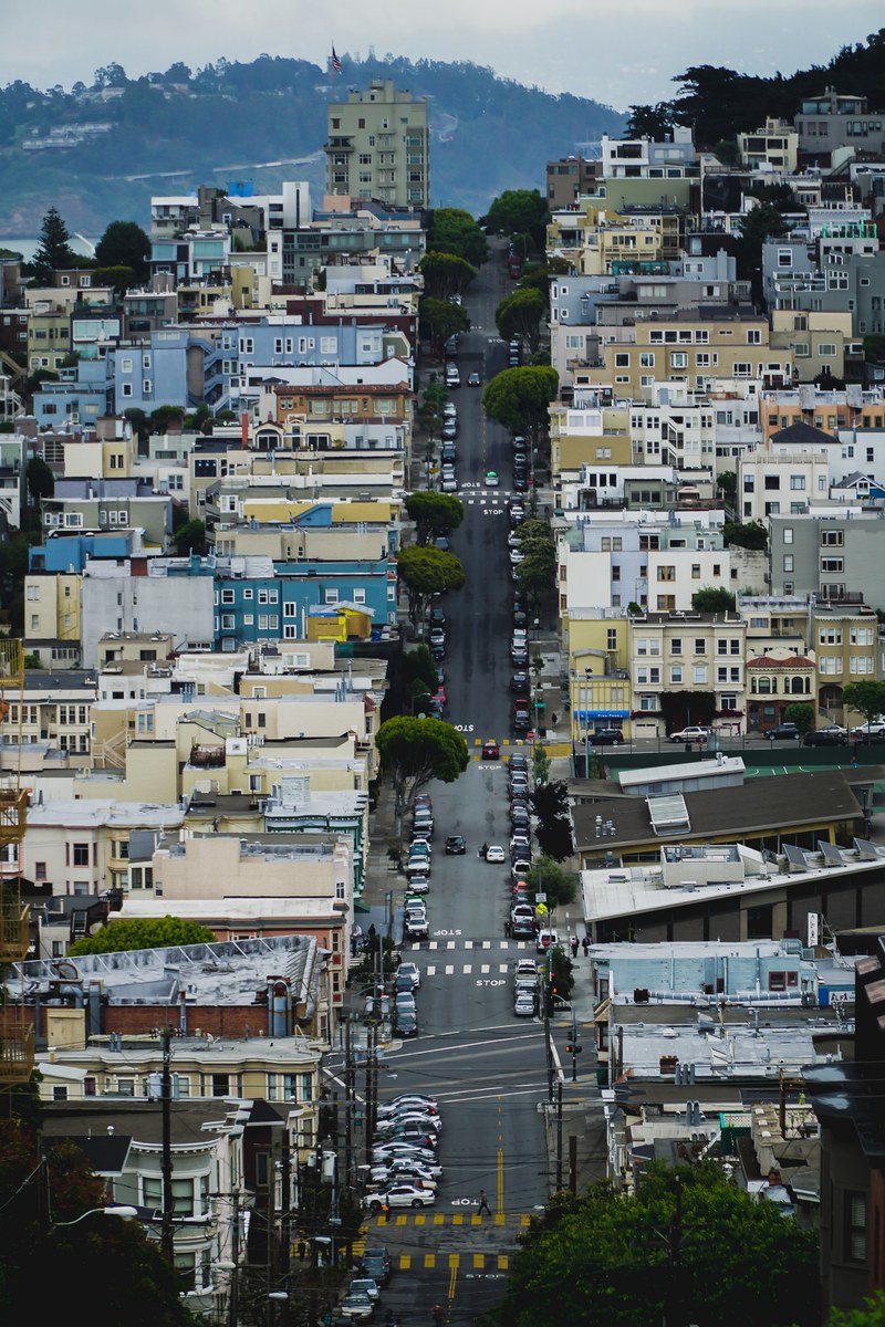 looking down a residential street in an urban city, _city life 4k