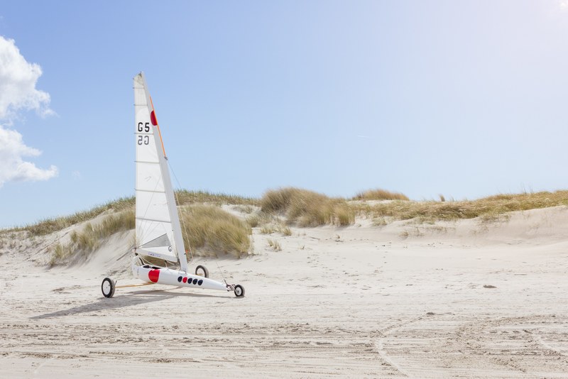 land sailing yacht on a sand beach in st_ peter ording, sailing 4k