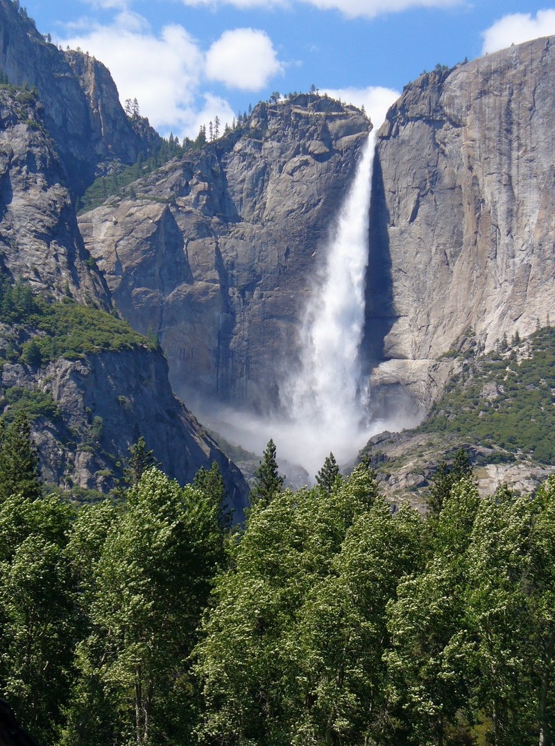 an impressive waterfall tumbling down from a vertical rock face in yosemite, yosemite waterfall 4k
