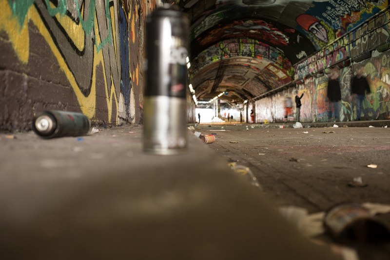 spray cans sit on curb on leake street graffiti tunnel, cans everywhere cans 4k