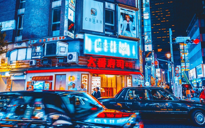 taxi cabs in a neon soaked street in tokyo, neon soaked tokyo street 4k