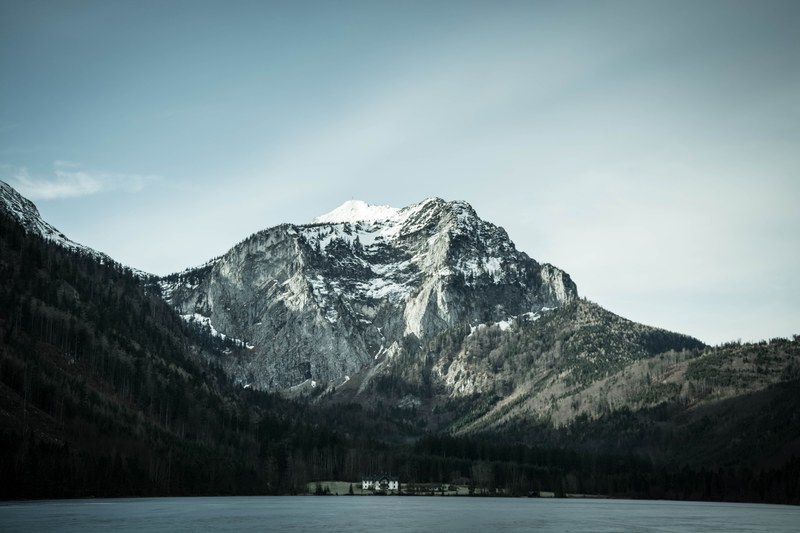 view from a mountain lake on a tourist resort at the foot of a towering mountain, view from the langbathsee mountain lake 4k