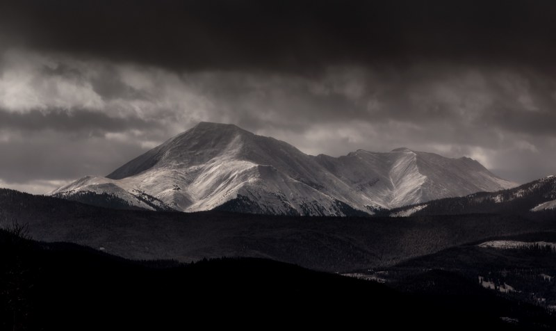 a black and white photo of a mountain range under clouds in silverthorne, black and white mountain range 4k