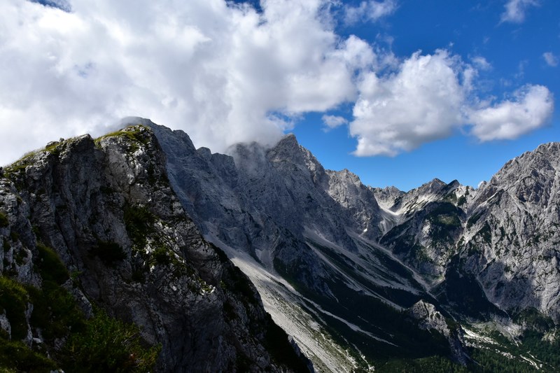 jagged mountain peaks over a glacial cirque on a cloudy day, glacial cirque under clouds 4k