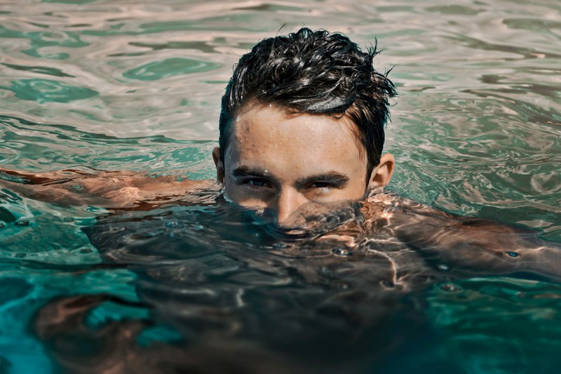 a man with wet hair and a partially submerged face in the water in grand rapids, submerged 4k