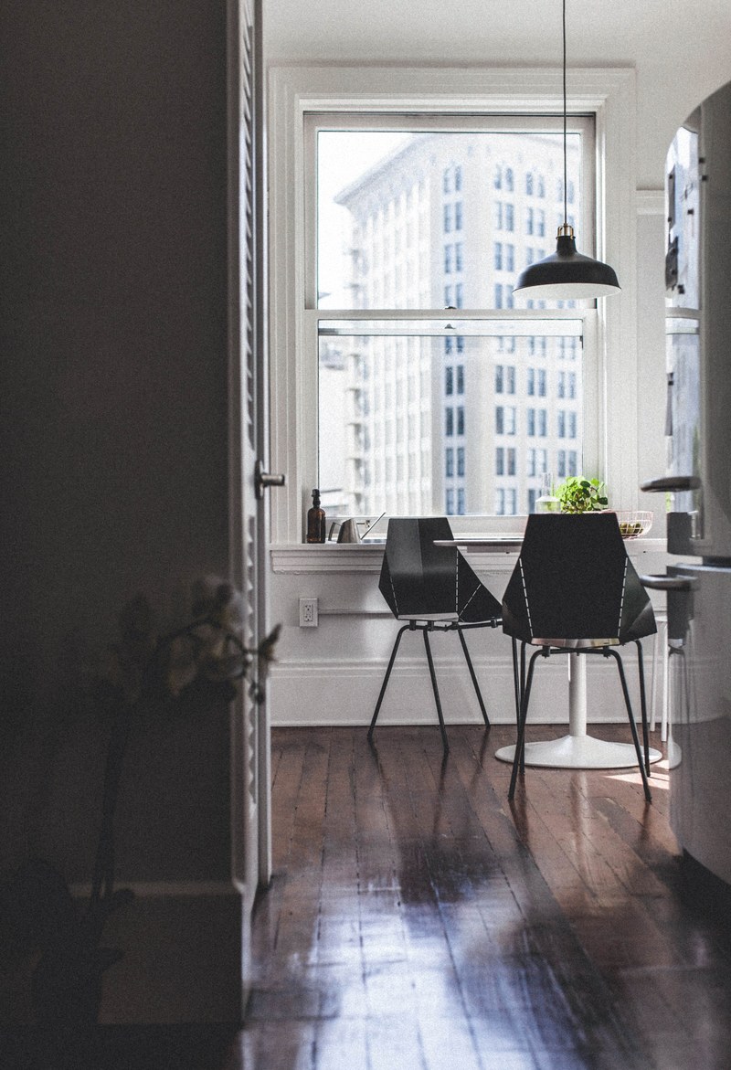 view from a hallway on the entrance to a kitchen in an apartment, kitchen in a cosy apartment 4k