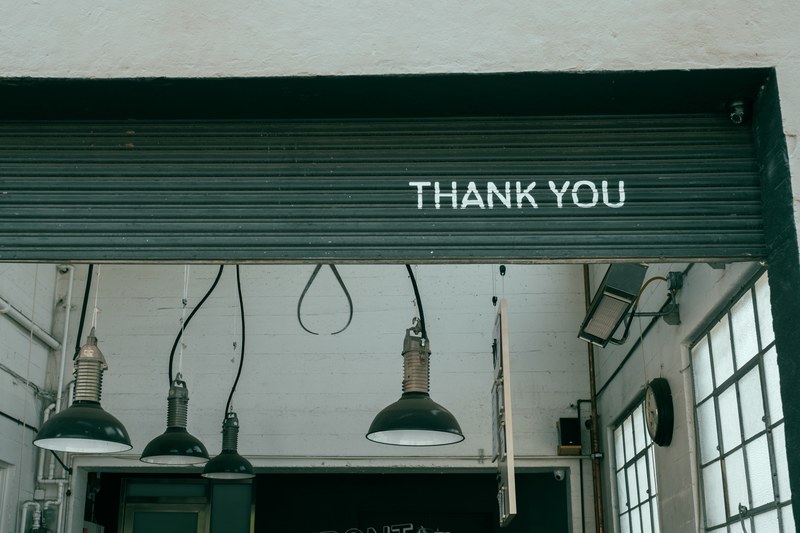 thank you written on a roll up wall in an industrial building, thank you garage interior 4k