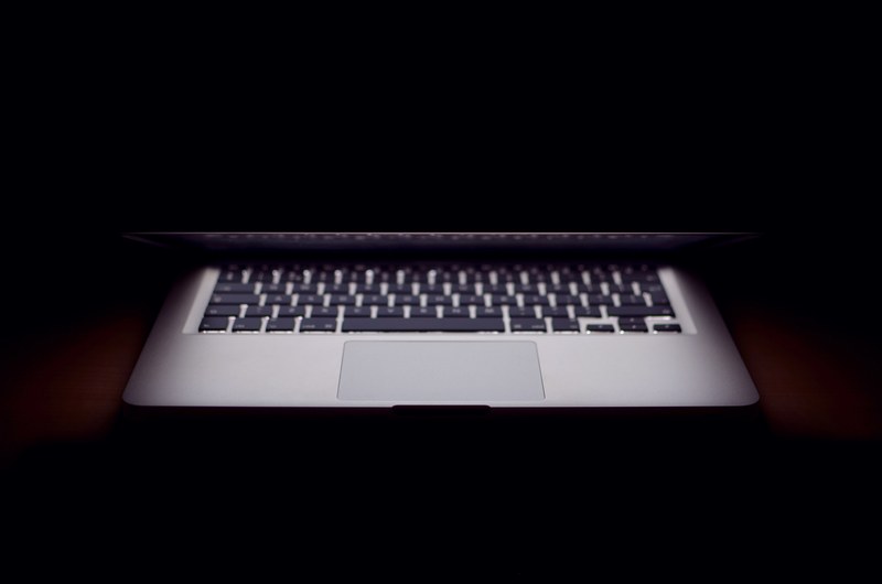a half closed macbook laptop computer without internet connection, half closed laptop 4k