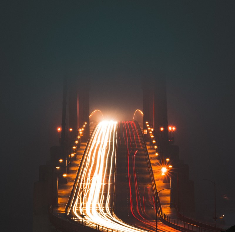 car light trails traveling along a sloped bridge, _traffic flow 4k
