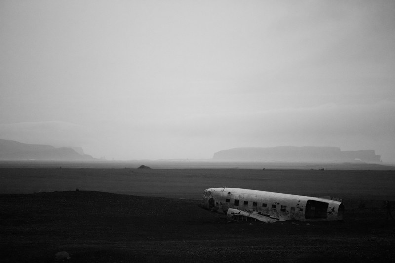 black and white shot of plane wreck with clear sky and mist solheimasandur plane wreck, monochrome plane wreck 4k