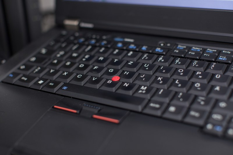 close up of the black keyboard of a business laptop, keyboard with trackball 4k