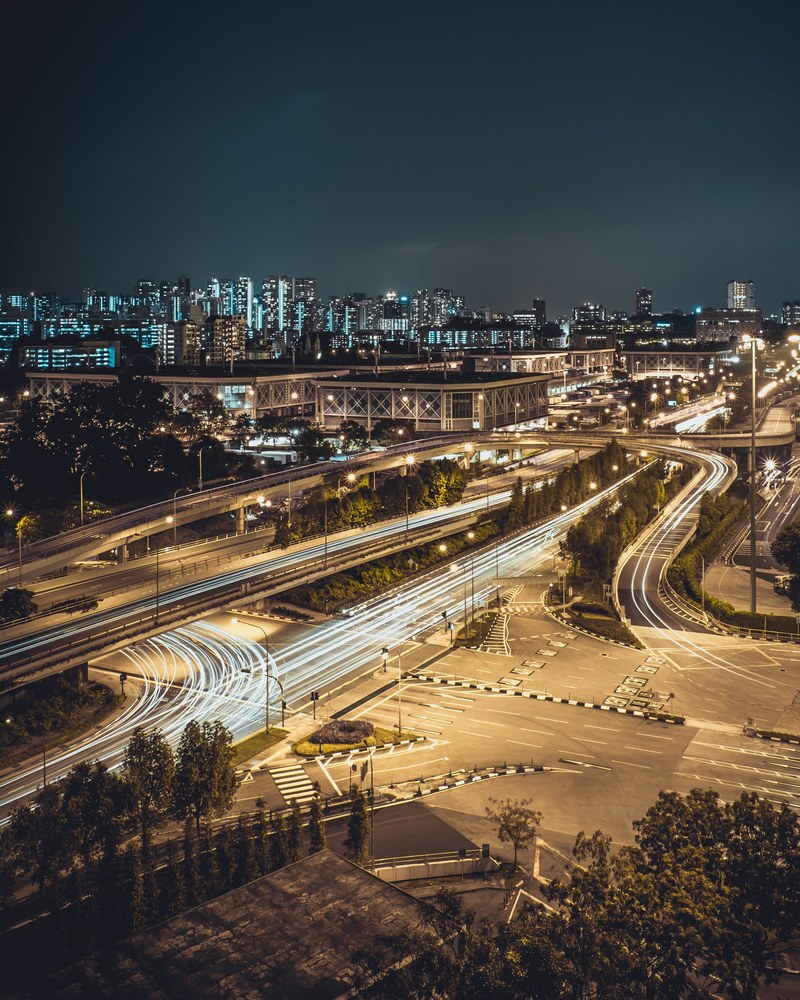 bright light trails on streets leading to a large city, well go slow in high tempo 4k