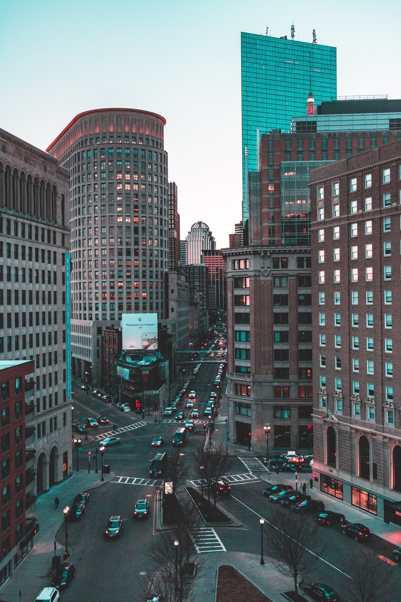 blue and red lights on buildings around an intersection in boston, 4 way 4k