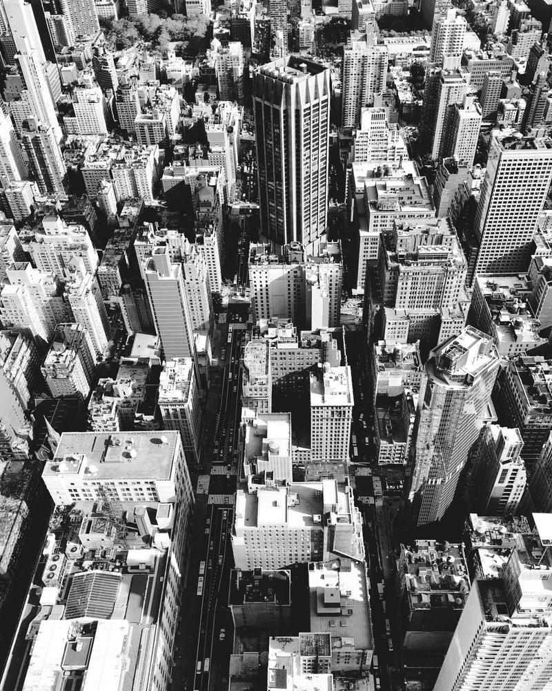 black and white drone shot of city buildings and skyscrapers, nyc 4k