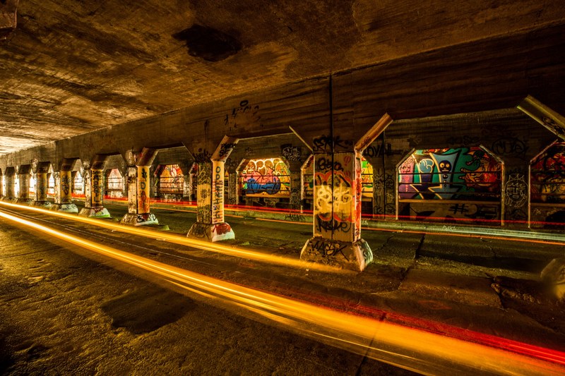 concrete tunnel with unique architecture and pillars covered in colorful graffiti krog street market, good art good hearts 4k