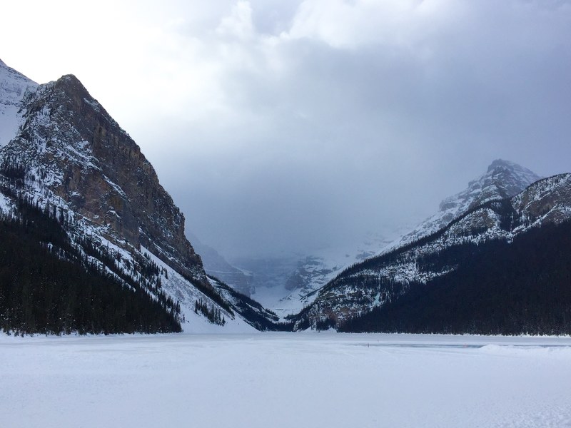 mountains extend beyond two mountain peaks dusted with snow, _two mountain peaks with snow 4k