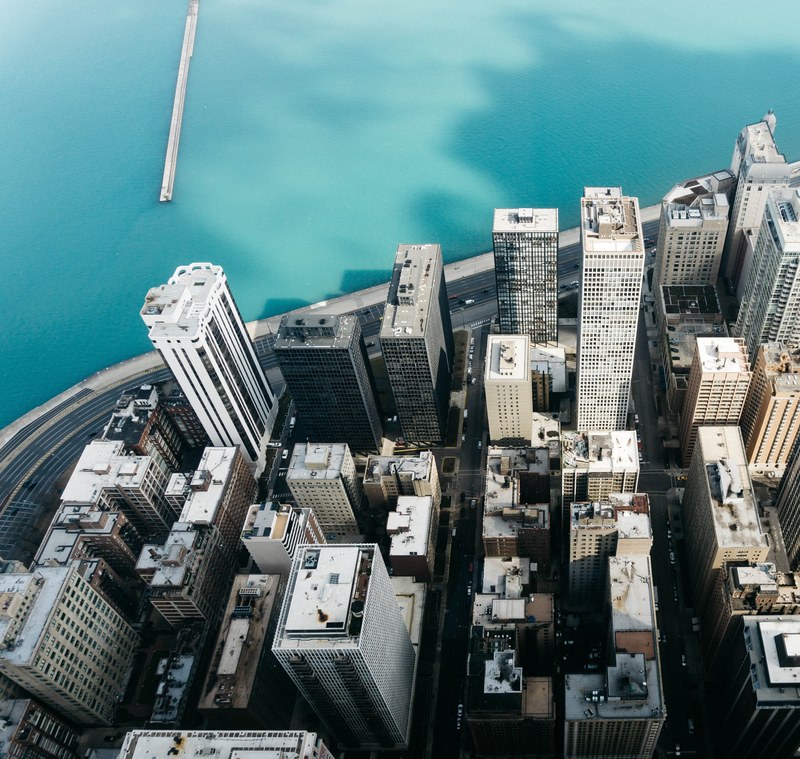 a drone shot of high rises near the michigan lake in chicago, edge 4k